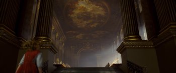 Movie still from “The Golden Compass” (2007), directed by Chris Weitz – A staircase in a building with a painting on the ceiling; Extreme Wide shot, Low angle