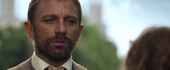 Movie still from “The Golden Compass” (2007), directed by Chris Weitz – A person wearing a suit and tie; Close Up shot, Over the shoulder angle