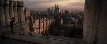 Movie still from “The Golden Compass” (2007), directed by Chris Weitz – An image of a person walking on a roof with a dog; Extreme Wide shot, High angle