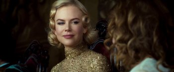 Movie still from “The Golden Compass” (2007), directed by Chris Weitz – A woman in a gold dress looking at her reflection in a mirror; Close Up shot, Over the shoulder angle