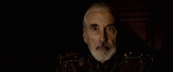 Movie still from “The Golden Compass” (2007), directed by Chris Weitz – An older man with a beard and a mustache; Close Up shot, Over the shoulder angle