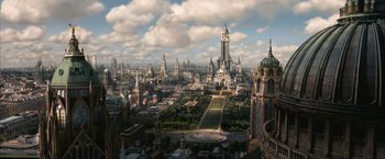Movie still from “The Golden Compass” (2007), directed by Chris Weitz – An aerial view of a large city with a lot of tall buildings; Extreme Wide shot, High angle