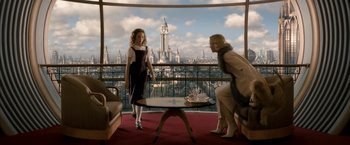 Movie still from “The Golden Compass” (2007), directed by Chris Weitz – Two women are standing in front of a window; Wide shot, Low angle