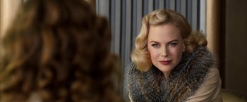 Movie still from “The Golden Compass” (2007), directed by Chris Weitz – A person wearing a fur coat; Close Up shot, Over the shoulder angle