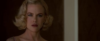 Movie still from “The Golden Compass” (2007), directed by Chris Weitz – A person wearing a dress; Close Up shot, Over the shoulder angle