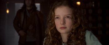 Movie still from “The Golden Compass” (2007), directed by Chris Weitz – A person with curly hair; Close Up shot, Low angle
