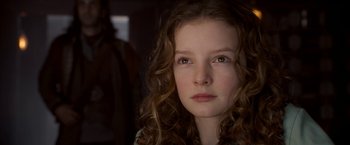 Movie still from “The Golden Compass” (2007), directed by Chris Weitz – A person with curly hair; Close Up shot, Low angle
