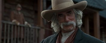 Movie still from “The Golden Compass” (2007), directed by Chris Weitz – An old man with a long beard wearing a cowboy hat; Close Up shot, Low angle