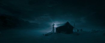 Movie still from “The Golden Compass” (2007), directed by Chris Weitz – A house in the middle of the night in the snow; Extreme Wide shot, Low angle