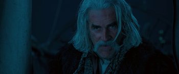 Movie still from “The Golden Compass” (2007), directed by Chris Weitz – An older man with long white hair and a beard; Close Up shot, Low angle