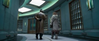 Movie still from “The Golden Compass” (2007), directed by Chris Weitz – A man and a woman are dressed in winter clothing; Wide shot, Low angle