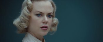 Movie still from “The Golden Compass” (2007), directed by Chris Weitz – A person with blonde hair; Close Up shot, Over the shoulder angle