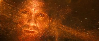 Movie still from “The Golden Compass” (2007), directed by Chris Weitz – A woman's face is lit up by the light of the sun; Extreme Close Up shot, Overhead angle