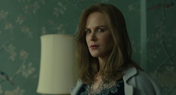 Movie still from “The Goldfinch” (2019), directed by John Crowley – A beautiful woman with long brown hair wearing a blue jacket; Close Up shot, Over the shoulder angle