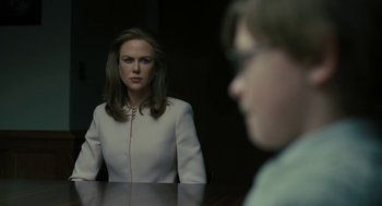 Movie still from “The Goldfinch” (2019), directed by John Crowley – A woman sitting at a table in front of a man; Close Up shot, Over the shoulder angle