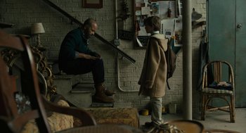 Movie still from “The Goldfinch” (2019), directed by John Crowley – A man sitting on the stairs with a little girl; Wide shot, Over the shoulder angle