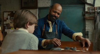 Movie still from “The Goldfinch” (2019), directed by John Crowley – A man and a boy sitting at a table; Medium shot, Over the shoulder angle