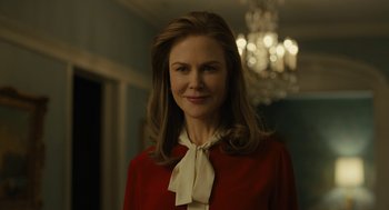 Movie still from “The Goldfinch” (2019), directed by John Crowley – A woman in a red shirt and a white bow tie; Close Up shot, Over the shoulder angle