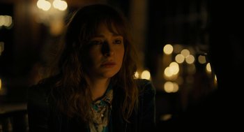 Movie still from “The Goldfinch” (2019), directed by John Crowley – A woman with red hair is looking at the camera; Close Up shot, Over the shoulder angle