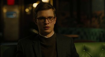 Movie still from “The Goldfinch” (2019), directed by John Crowley – A young man wearing glasses and a suit; Close Up shot, Low angle