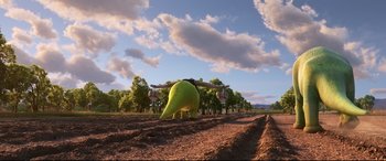 Movie still from “The Good Dinosaur” (2015), directed by Peter Sohn – An apple sitting in the middle of an open field; Extreme Wide shot, High angle