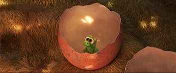 Movie still from “The Good Dinosaur” (2015), directed by Peter Sohn – A toy dinosaur inside of an egg shell; Close Up shot, Overhead angle