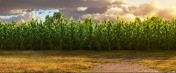 Movie still from “The Good Dinosaur” (2015), directed by Peter Sohn – A field with a lot of tall corn plants; Extreme Wide shot, Low angle