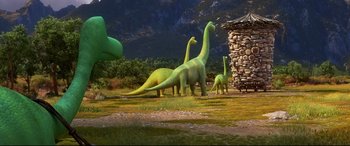 Movie still from “The Good Dinosaur” (2015), directed by Peter Sohn – A group of dinosaurs standing next to each other in the grass; Extreme Wide shot, Low angle