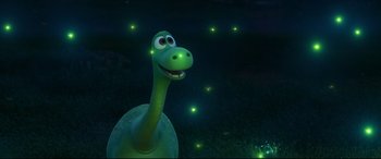 Movie still from “The Good Dinosaur” (2015), directed by Peter Sohn – A green dinosaur's head with glowing lights in the background; Medium shot, High angle