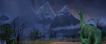 Movie still from “The Good Dinosaur” (2015), directed by Peter Sohn – A painting of a mountain range with a forest in the background; Extreme Wide shot, Low angle