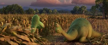Movie still from “The Good Dinosaur” (2015), directed by Peter Sohn – Two dinosaurs in the middle of a corn field; Wide shot, High angle
