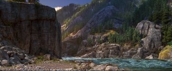 Movie still from “The Good Dinosaur” (2015), directed by Peter Sohn – A river flowing through a valley surrounded by mountains and trees; Extreme Wide shot, High angle