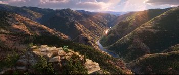 Movie still from “The Good Dinosaur” (2015), directed by Peter Sohn – A view of a valley from a mountain top; Extreme Wide shot, High angle