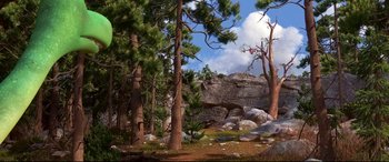 Movie still from “The Good Dinosaur” (2015), directed by Peter Sohn – Trees and rocks in the background; Extreme Wide shot, High angle