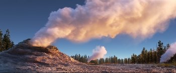 Movie still from “The Good Dinosaur” (2015), directed by Peter Sohn – A cloud of smoke rises above a mountain; Extreme Wide shot, Low angle