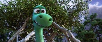 Movie still from “The Good Dinosaur” (2015), directed by Peter Sohn – The head of a green dinosaur; Close Up shot, High angle
