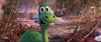 Movie still from “The Good Dinosaur” (2015), directed by Peter Sohn – The head and neck of a green dinosaur; Close Up shot, High angle