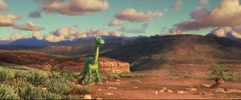 Movie still from “The Good Dinosaur” (2015), directed by Peter Sohn – An animated dinosaur in the middle of the desert; Extreme Wide shot, High angle