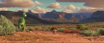 Movie still from “The Good Dinosaur” (2015), directed by Peter Sohn – An animal standing in the middle of a field; Extreme Wide shot, High angle