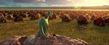 Movie still from “The Good Dinosaur” (2015), directed by Peter Sohn – An image of a herd of animals in a field; Extreme Wide shot, High angle