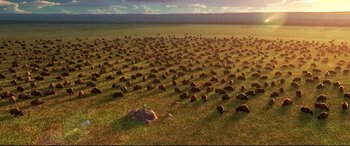 Movie still from “The Good Dinosaur” (2015), directed by Peter Sohn – Many rocks in the grass; Extreme Wide shot, Overhead angle