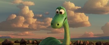 Movie still from “The Good Dinosaur” (2015), directed by Peter Sohn – The head and neck of a green dinosaur; Close Up shot, High angle