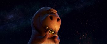 Movie still from “The Good Dinosaur” (2015), directed by Peter Sohn – An animated dog holding a sandwich in his mouth; Close Up shot, Low angle