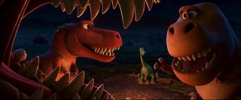 Movie still from “The Good Dinosaur” (2015), directed by Peter Sohn – A group of dinosaurs in a field at night time; Medium shot, High angle