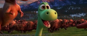 Movie still from “The Good Dinosaur” (2015), directed by Peter Sohn – The head of a green dinosaur; Close Up shot, High angle