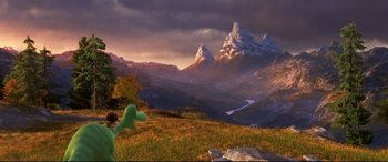 Movie still from “The Good Dinosaur” (2015), directed by Peter Sohn – A mountain range with snow on top of a hill; Extreme Wide shot, High angle