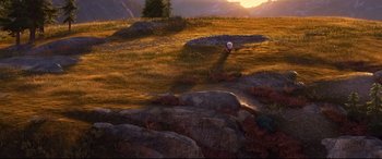 Movie still from “The Good Dinosaur” (2015), directed by Peter Sohn – A ball is flying through the air on a field; Extreme Wide shot, High angle