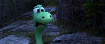 Movie still from “The Good Dinosaur” (2015), directed by Peter Sohn – The head of a green dinosaur; Close Up shot, High angle