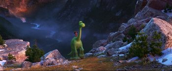 Movie still from “The Good Dinosaur” (2015), directed by Peter Sohn – A man sitting on the back of a green dinosaur; Extreme Wide shot, High angle