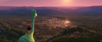 Movie still from “The Good Dinosaur” (2015), directed by Peter Sohn – An image of an animated movie scene with a giant green creature; Extreme Wide shot, High angle